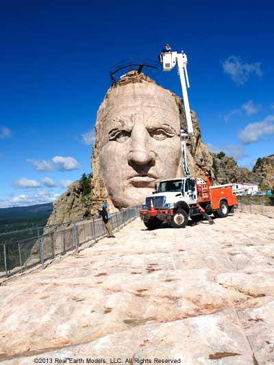 Face of Crazy Horse being serviced with cherry-picker