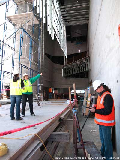 REM representative examining Ross Perot museum construction